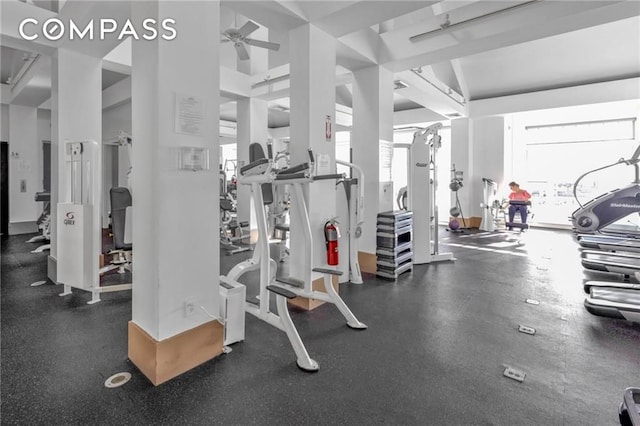 workout area featuring a ceiling fan