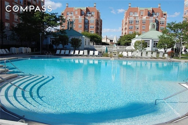 community pool featuring fence