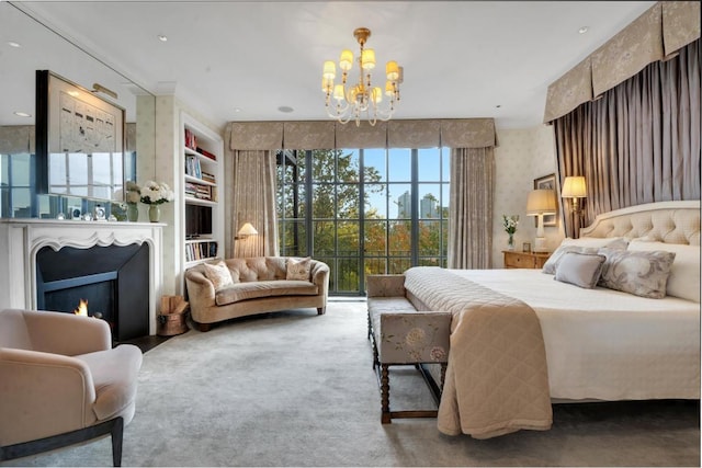 bedroom with an inviting chandelier and carpet