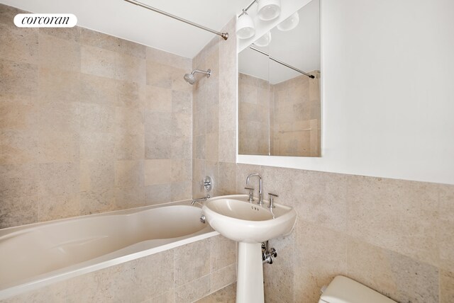 kitchen with hanging light fixtures, white cabinets, appliances with stainless steel finishes, and sink