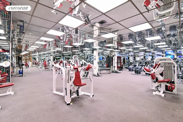 exercise room featuring a drop ceiling