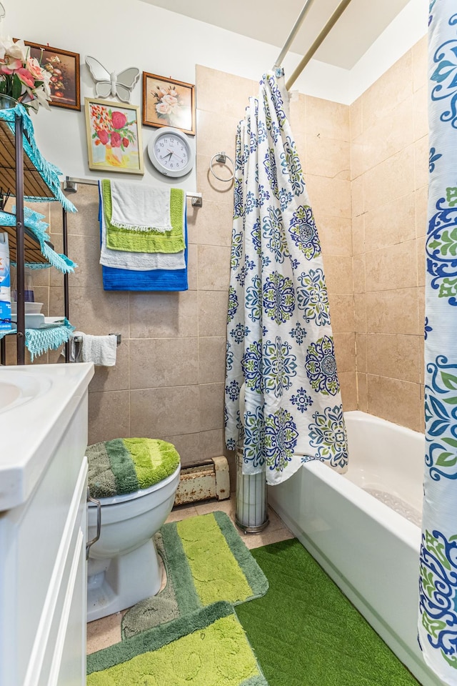 full bath featuring toilet, shower / bath combo, tile walls, and vanity