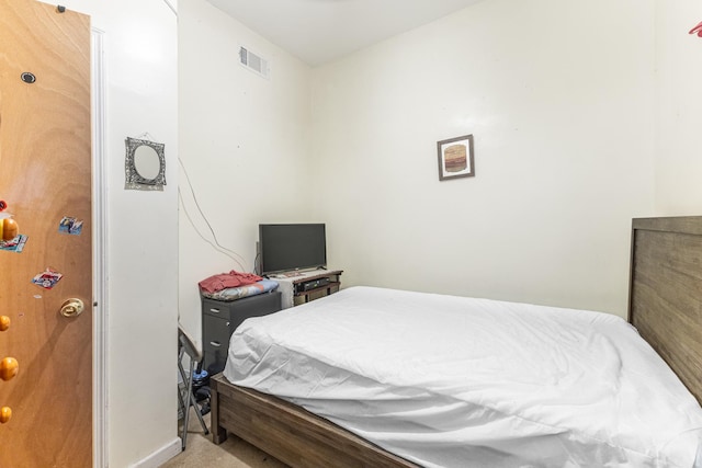 carpeted bedroom with visible vents