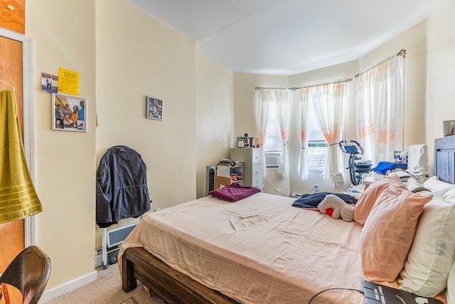 carpeted bedroom with baseboards