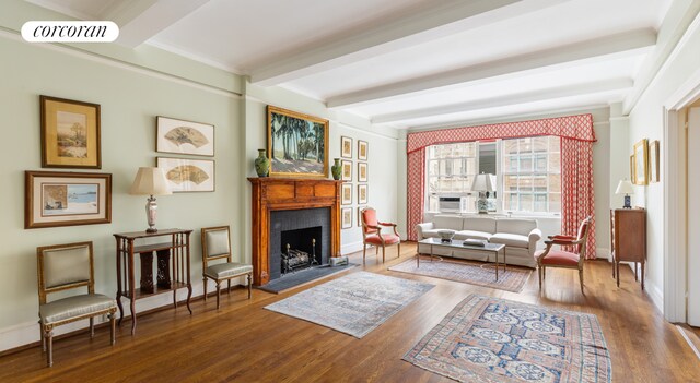 corridor with beamed ceiling, ornamental molding, and dark hardwood / wood-style flooring