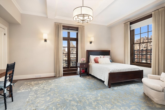 bedroom with a chandelier, multiple windows, ornamental molding, and baseboards