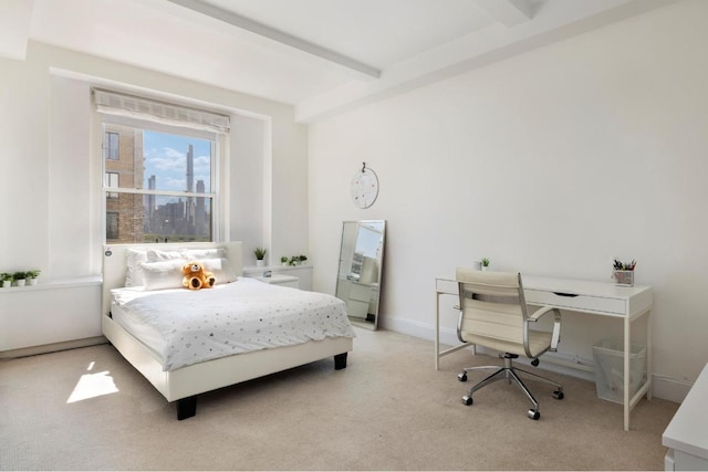 bedroom featuring beam ceiling and light carpet