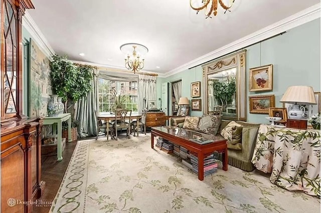 living room with an inviting chandelier and ornamental molding