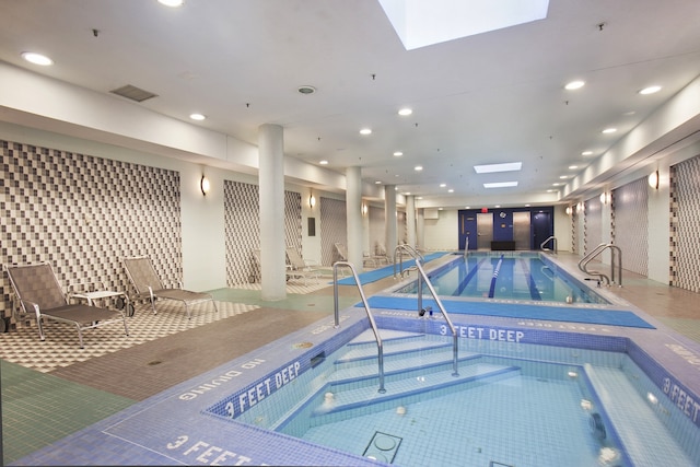 pool featuring a skylight