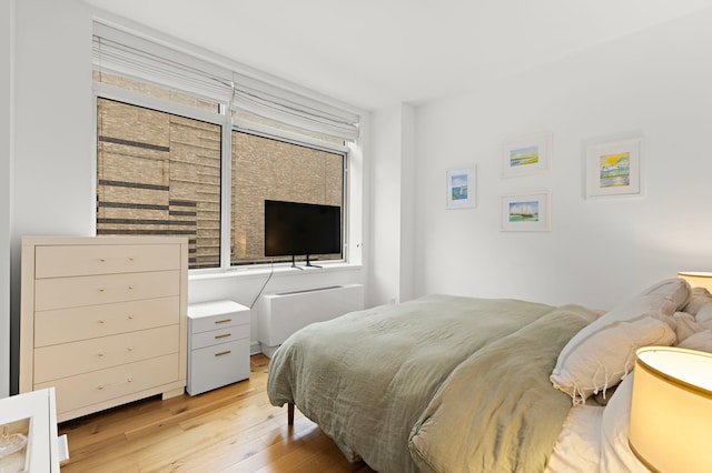 bedroom featuring light wood-style floors