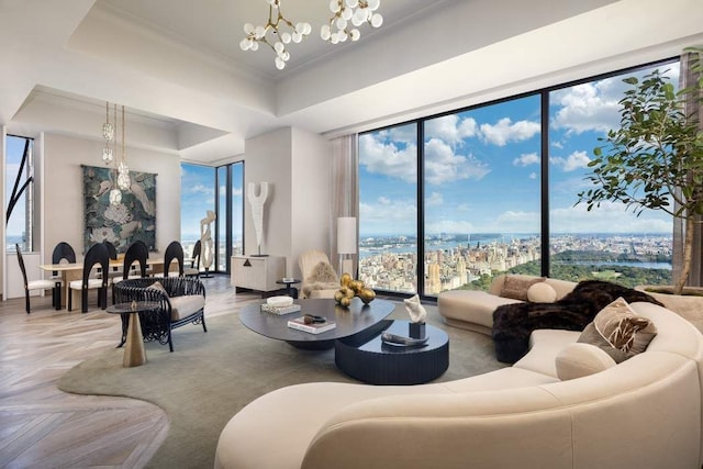 living room featuring a notable chandelier and a raised ceiling