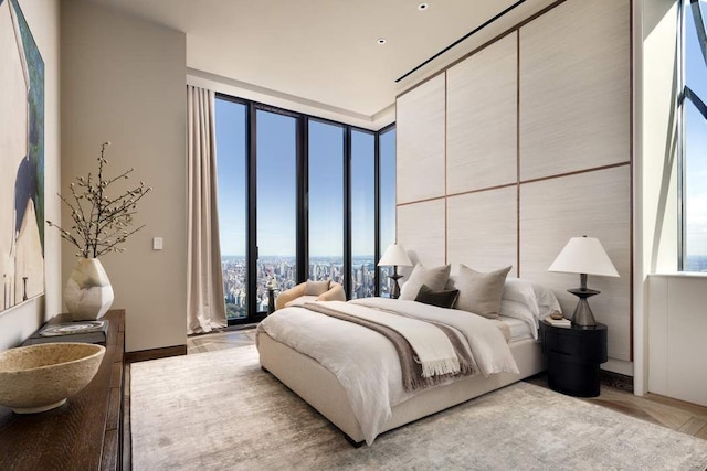 bedroom with floor to ceiling windows