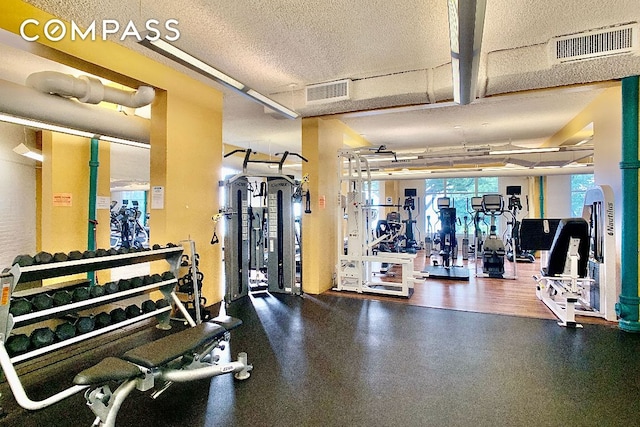 workout area featuring a textured ceiling