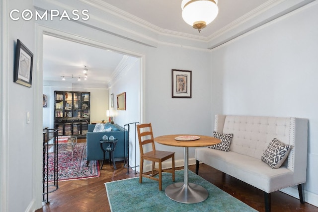 living area with crown molding and dark parquet floors