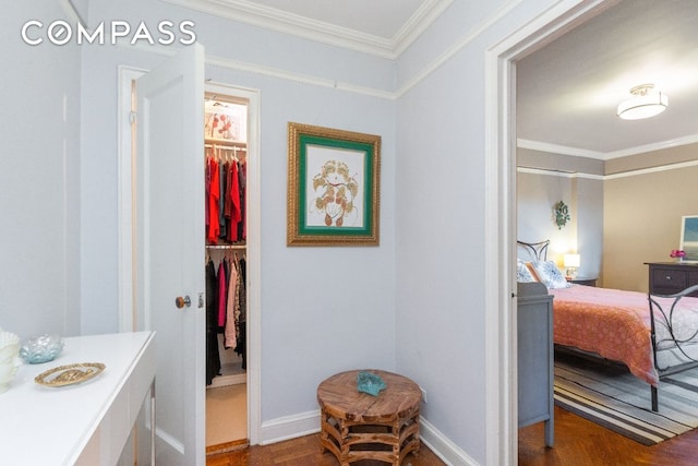 bathroom featuring ornamental molding and wood-type flooring