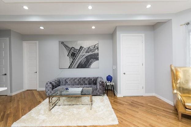 sitting room with recessed lighting, wood finished floors, and baseboards