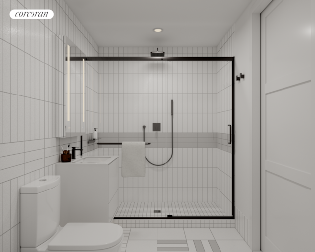 bathroom with toilet, tile walls, tile patterned floors, walk in shower, and vanity