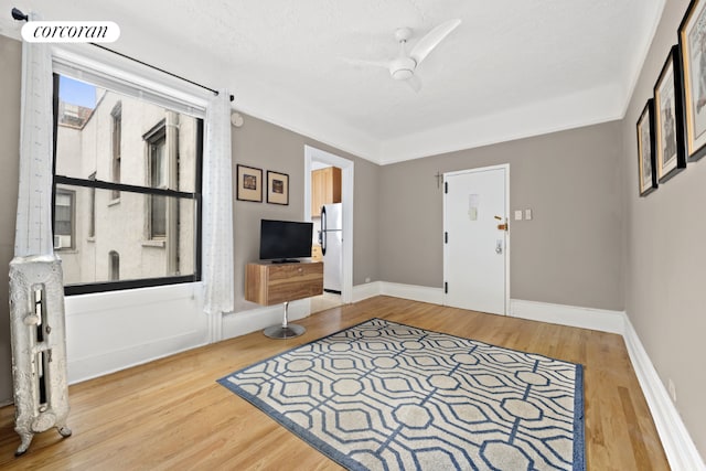 foyer entrance featuring a textured ceiling and hardwood / wood-style flooring