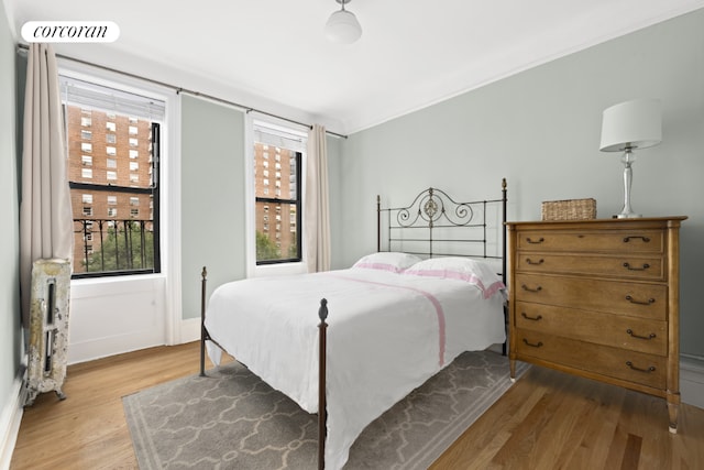 bedroom with light hardwood / wood-style flooring