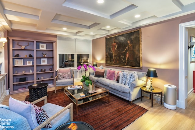 living room with beamed ceiling, coffered ceiling, and light hardwood / wood-style flooring