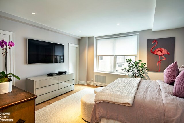 bedroom with light hardwood / wood-style floors