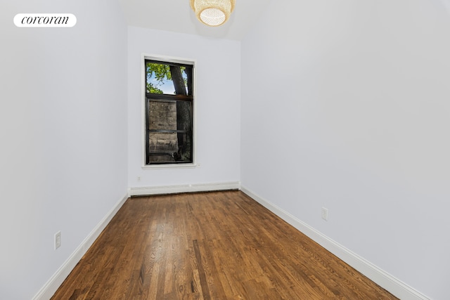 spare room with wood-type flooring