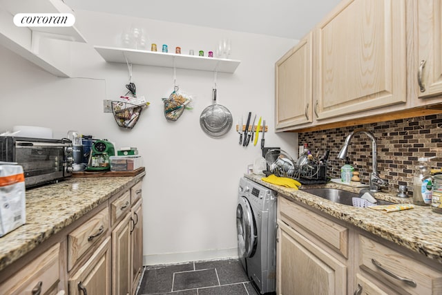 laundry area with washer / clothes dryer and sink