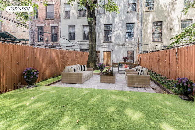 view of yard with an outdoor living space and a patio