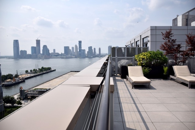 view of patio / terrace with a water view