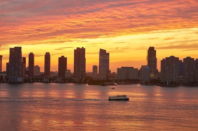 property's view of city with a water view