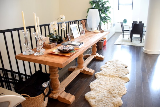 dining area with dark hardwood / wood-style flooring