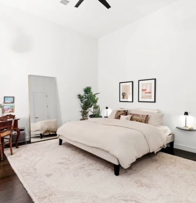 bedroom featuring ceiling fan and dark hardwood / wood-style flooring