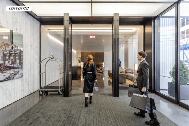 gym with floor to ceiling windows