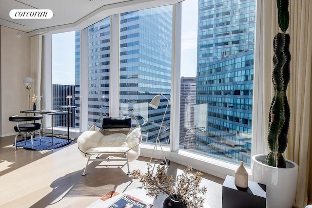 sitting room featuring floor to ceiling windows