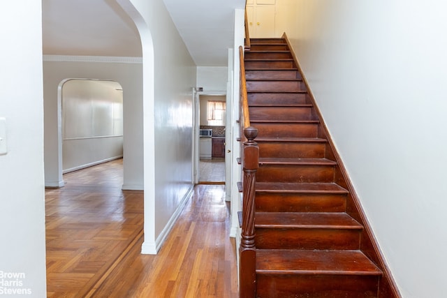 stairs featuring ornamental molding