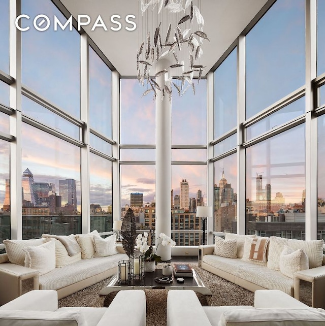 sunroom featuring an inviting chandelier