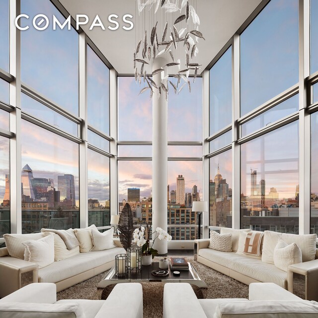 sunroom featuring a notable chandelier