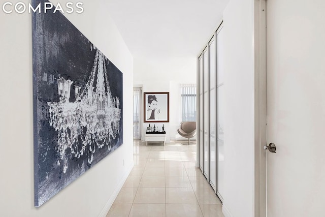 corridor featuring light tile patterned flooring