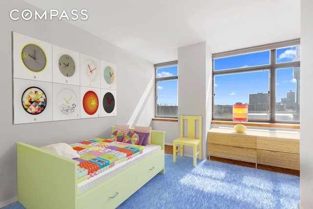 112-01 Queens Blvd Unit 8B, New York City, NY 11375 - bedroom featuring a view of skyline and carpet floors