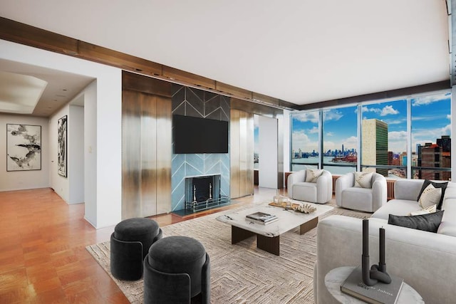 living room with expansive windows and a premium fireplace