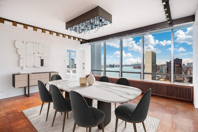 dining space featuring a water view