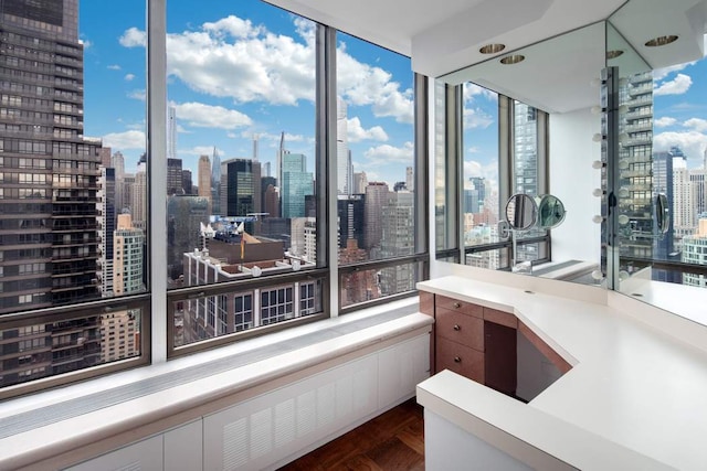 bathroom with parquet flooring and floor to ceiling windows