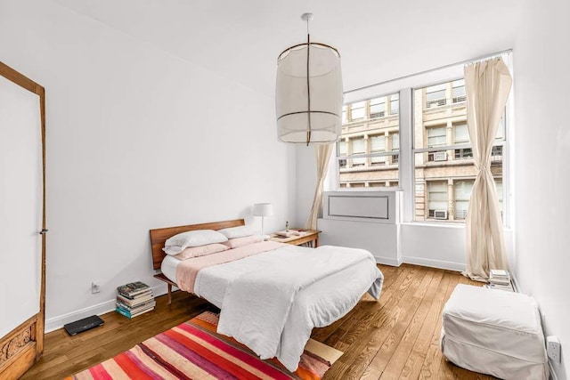 bedroom featuring wood-type flooring