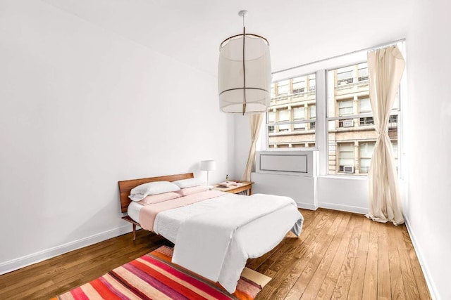 bedroom featuring wood-type flooring