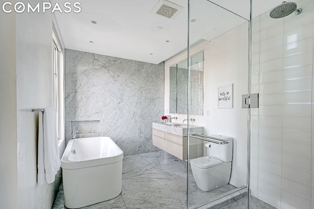 53 Leonard St Ph, Ph, New York City, NY 10013 - full bath with tile walls, vanity, marble tiled floors, a shower stall, and a freestanding tub