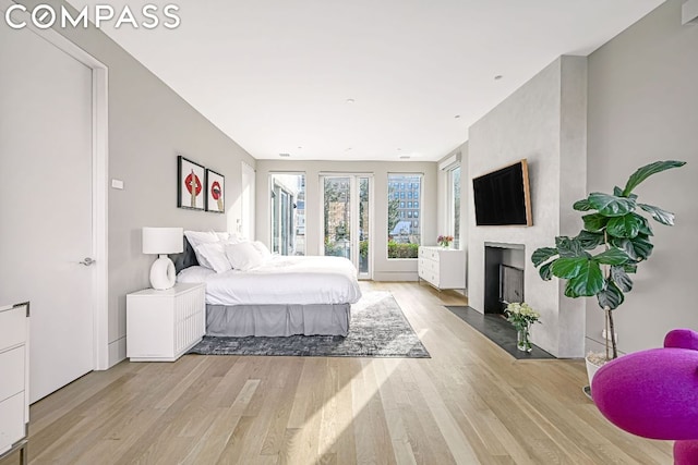 53 Leonard St Ph, Ph, New York City, NY 10013 - bedroom featuring wood finished floors and a fireplace