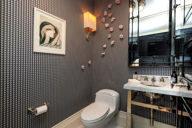 bathroom featuring sink and toilet