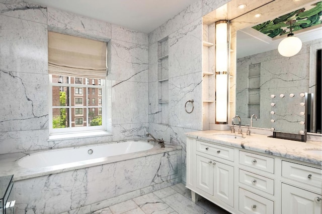 bathroom featuring vanity, tile walls, and a relaxing tiled tub