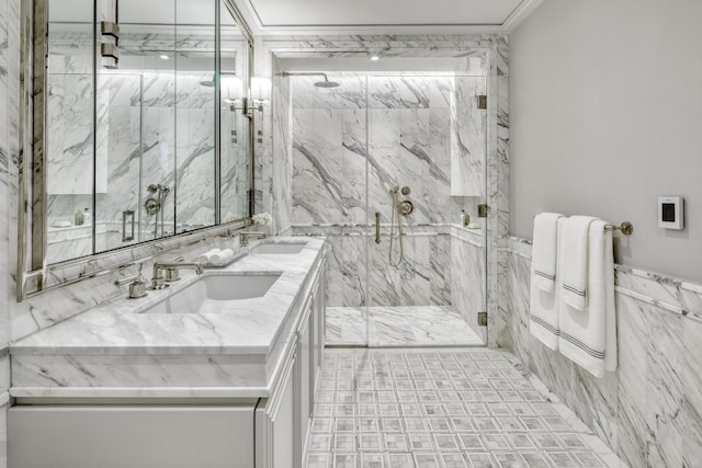 bathroom with vanity, a shower with shower door, and tile walls