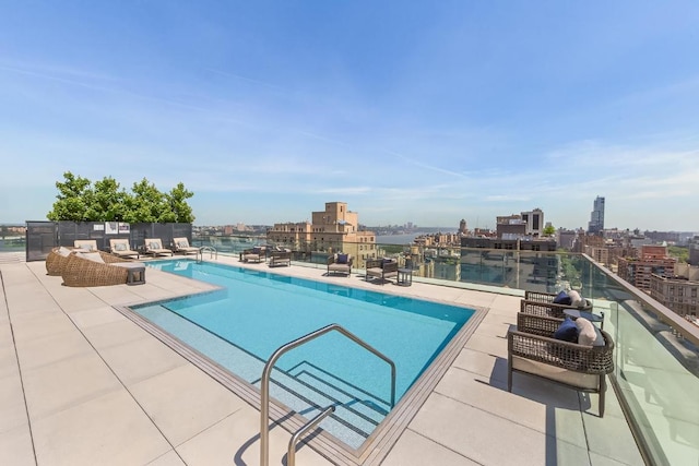 view of swimming pool with a patio